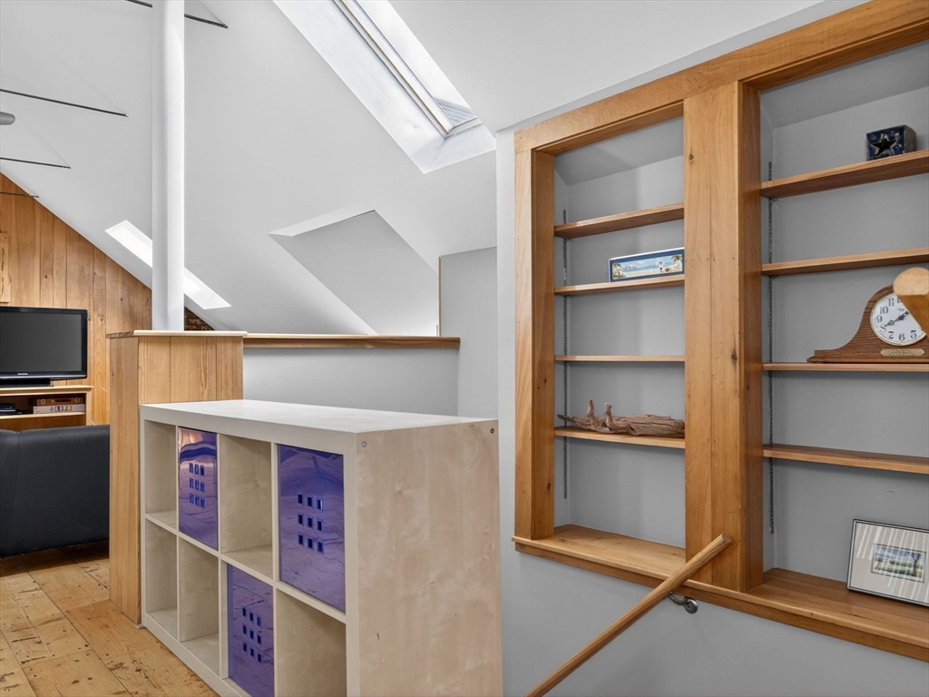 25 Danforth Street, Unit 3 Boston, MA 02130 - Photo 17 of 38 a utility room with stainless steel appliances wooden floor and a window