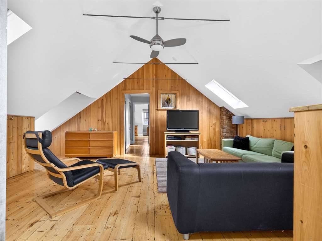 25 Danforth Street, Unit 3 Boston, MA 02130 - Photo 19 of 38 a living room with furniture and a flat screen tv