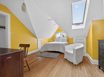 a bedroom with a bed and a table