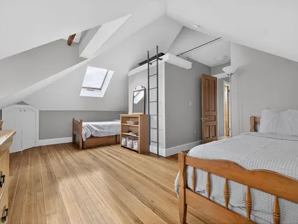 a room with furniture a flat screen tv and a fireplace