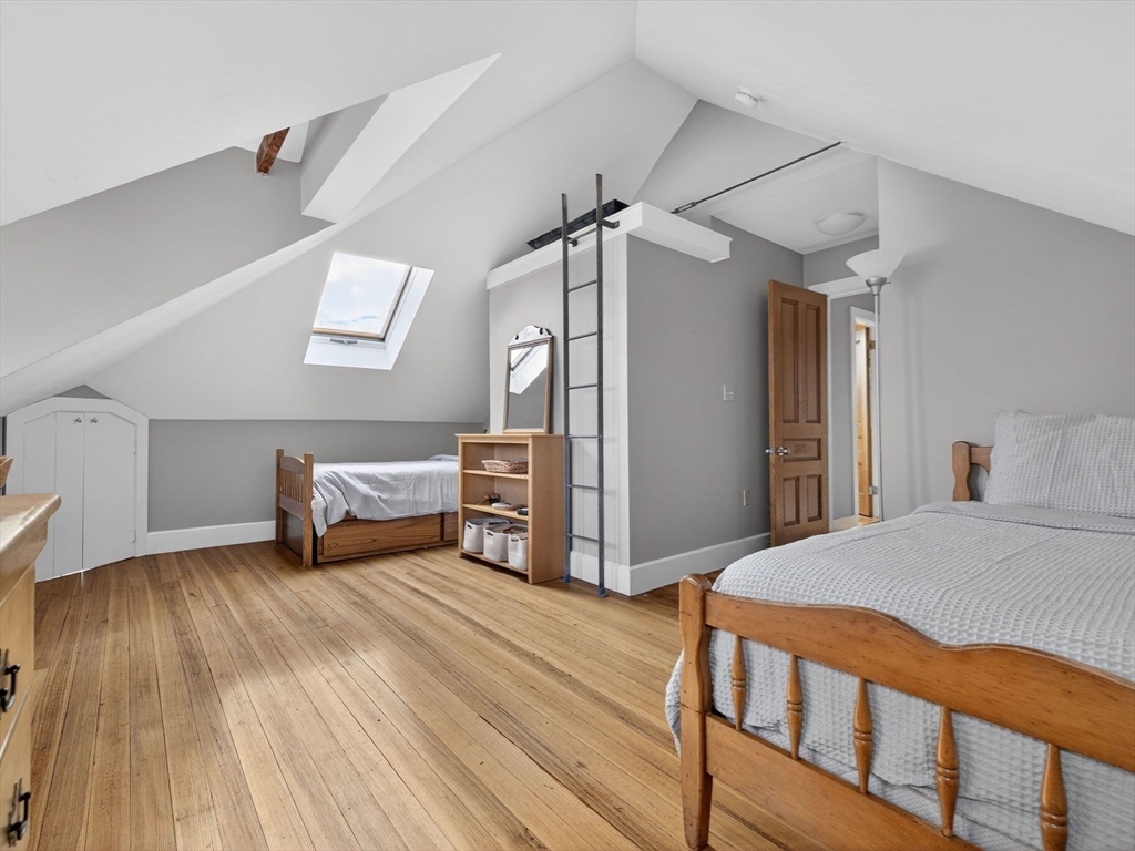 25 Danforth Street, Unit 3 Boston, MA 02130 - Photo 24 of 38 a bedroom with a bed and a table