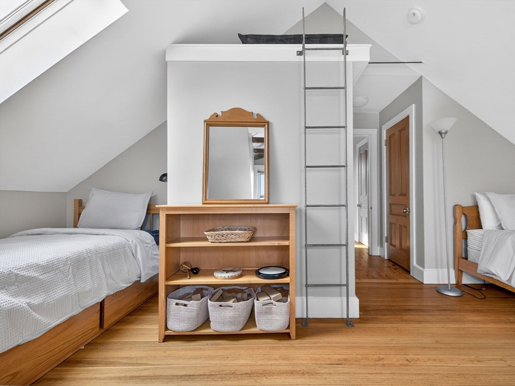 25 Danforth Street, Unit 3 Boston, MA 02130 - Photo 25 of 38 a bedroom with a bed and wooden floor