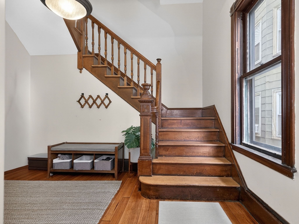 25 Danforth Street, Unit 3 Boston, MA 02130 - Photo 3 of 38 a view of entryway and hall with wooden floor