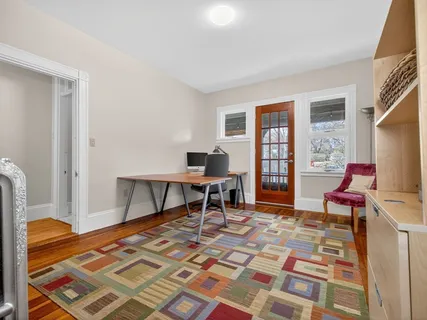 a backyard of a house with table and chairs