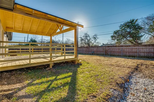 a view of a backyard with a tub
