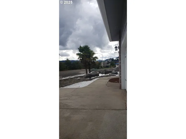 a spacious bathroom with a sink a washer and dryer