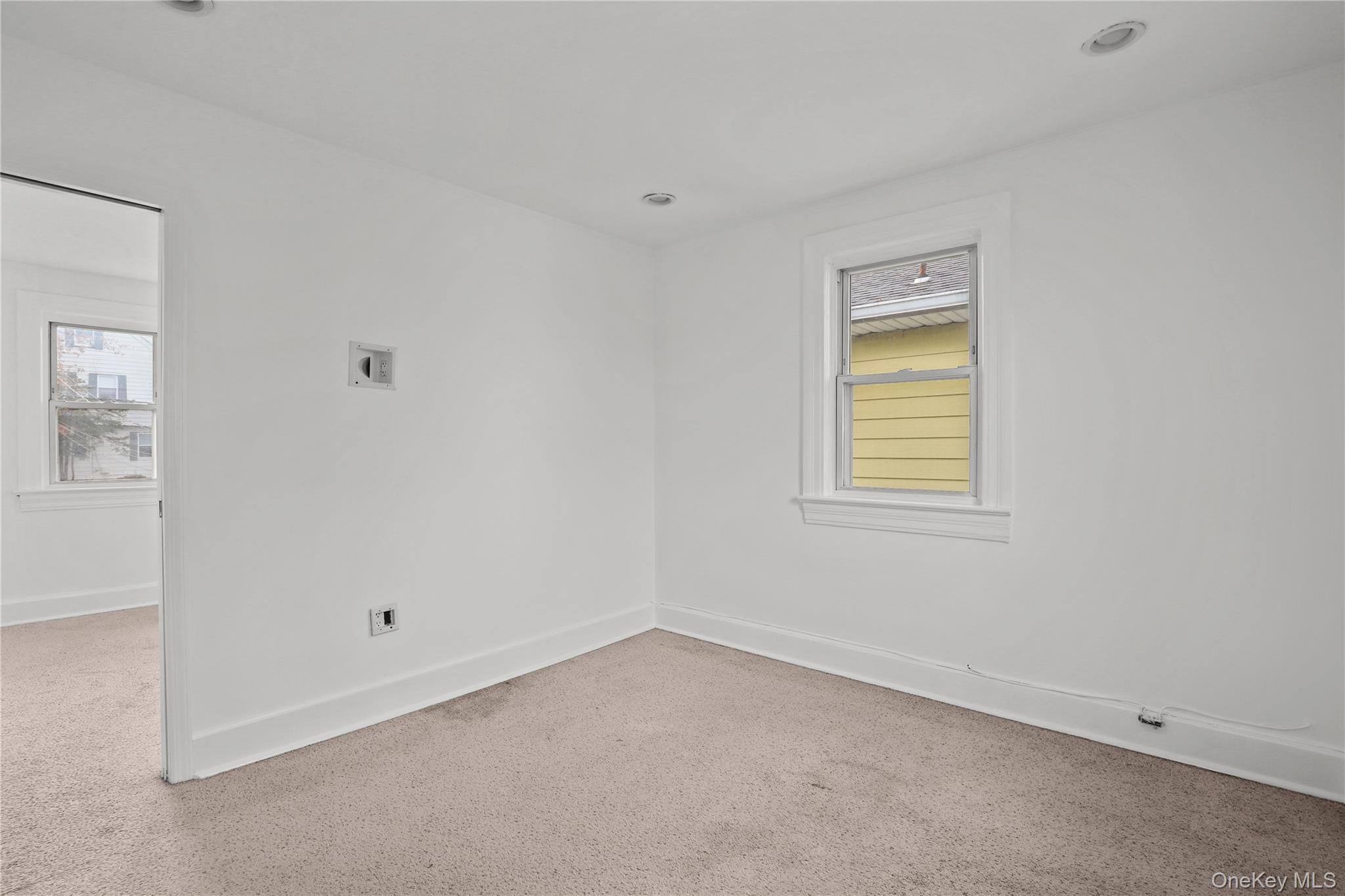 69 Clinton Avenue New Rochelle, NY 10801 - Photo 16 of 29 an empty room with a window