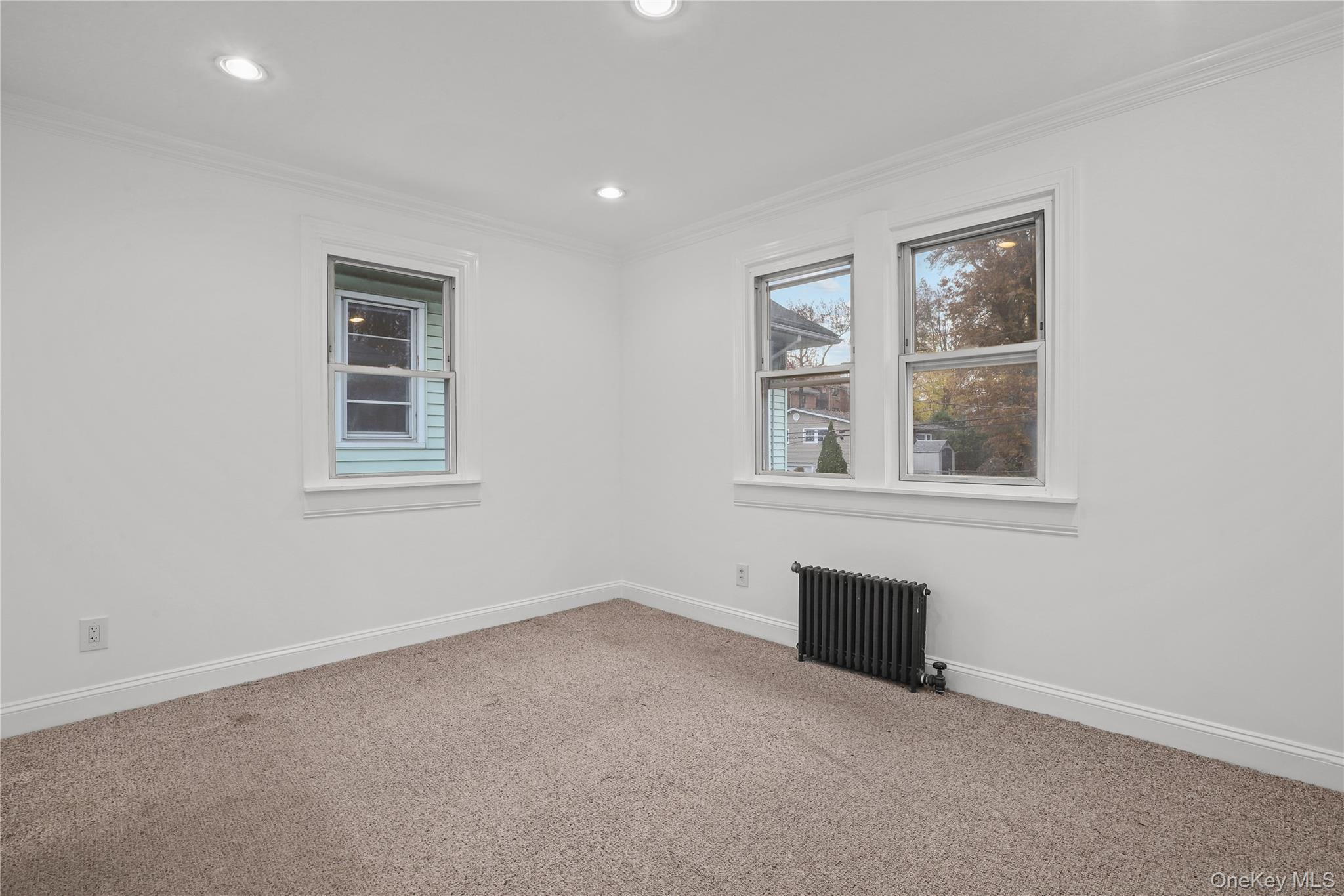 69 Clinton Avenue New Rochelle, NY 10801 - Photo 17 of 29 an empty room with a window
