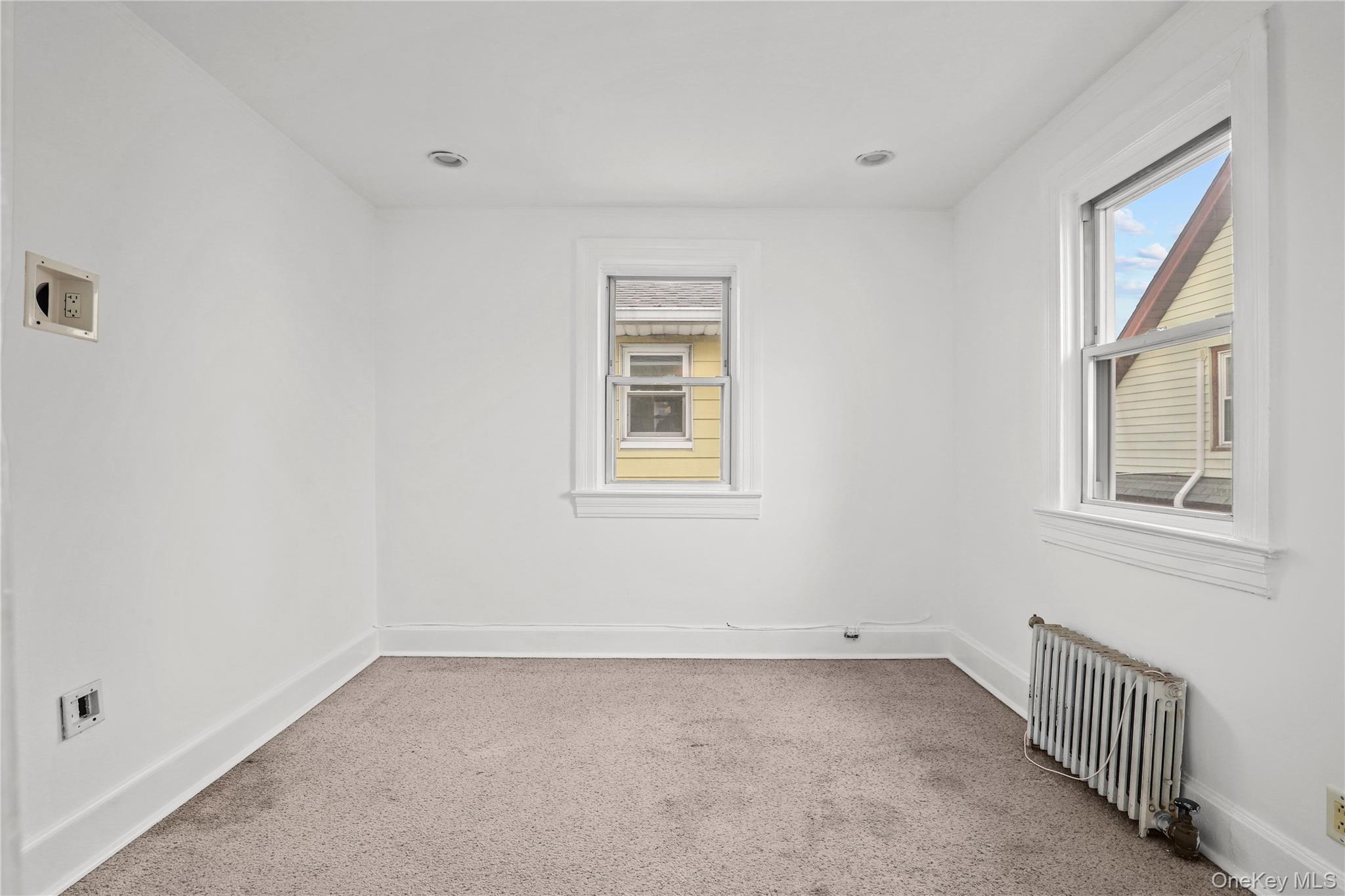 69 Clinton Avenue New Rochelle, NY 10801 - Photo 19 of 29 a view of a room that has a window in it