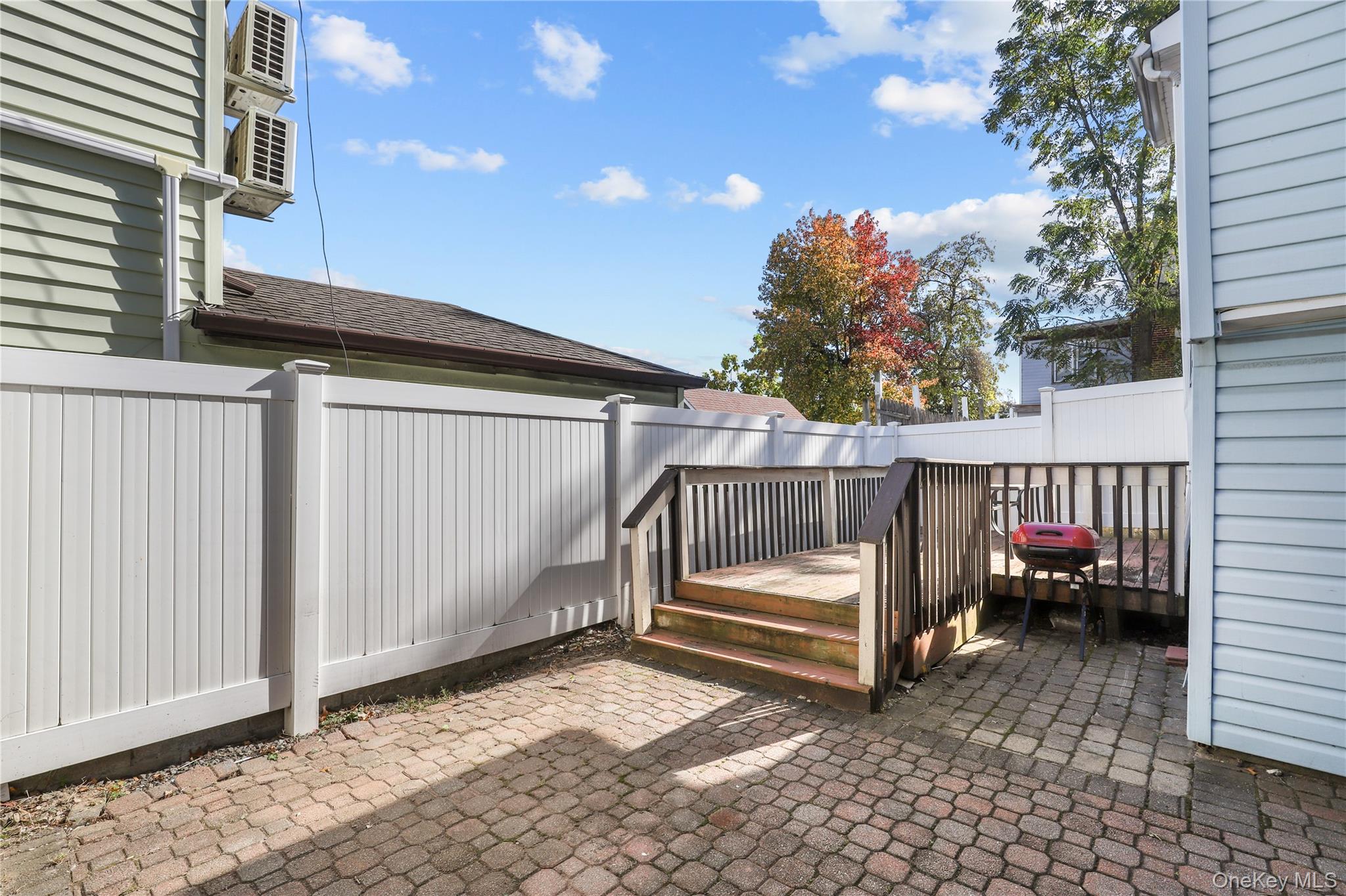 69 Clinton Avenue New Rochelle, NY 10801 - Photo 27 of 29 a view of porch with a bench