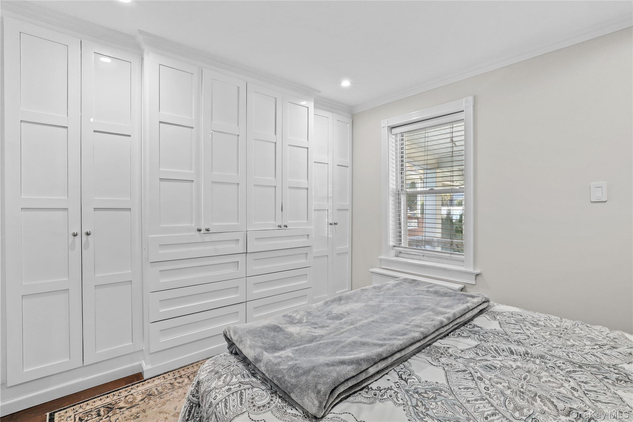 69 Clinton Avenue New Rochelle, NY 10801 - Photo 10 of 29 a view of an empty room and window