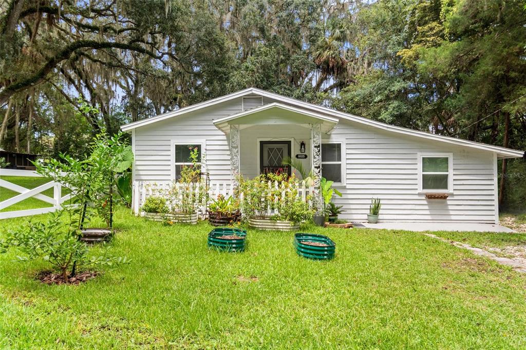 6025 Ave J McIntosh, FL 32667 - Photo 1 of 1 a house view with a garden space