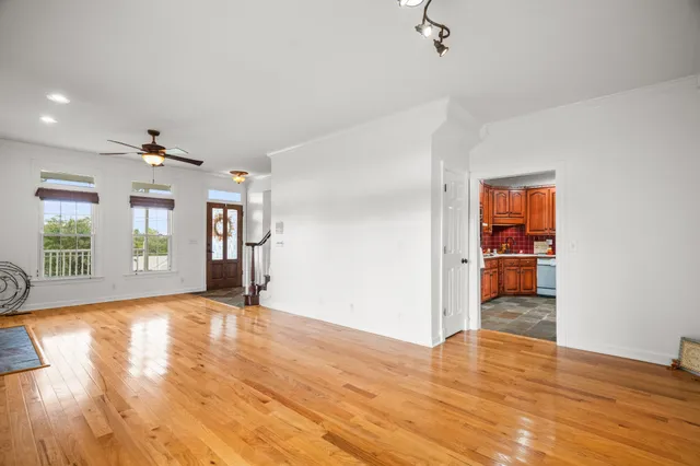 a kitchen with stainless steel appliances granite countertop a sink a stove and a refrigerator