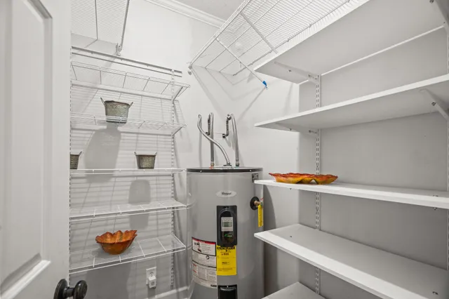 a bathroom with a double vanity sink toilet and shower