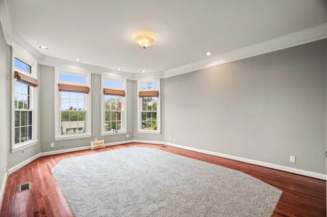 a spacious bathroom with double sink and a shower