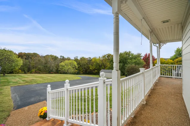 a view of a house with a sink and yard