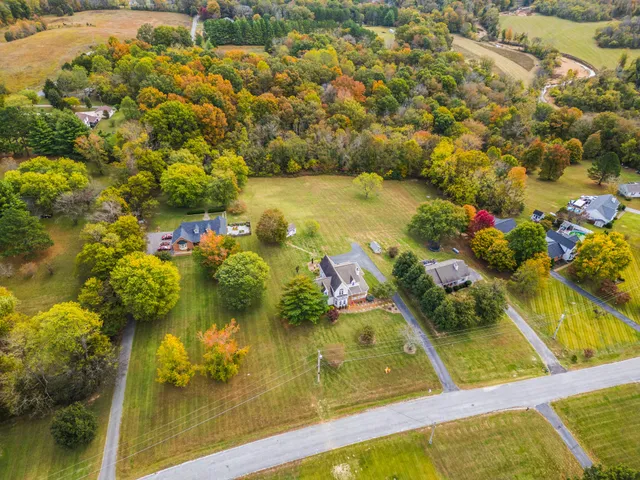 a view of residential houses with swimming pool