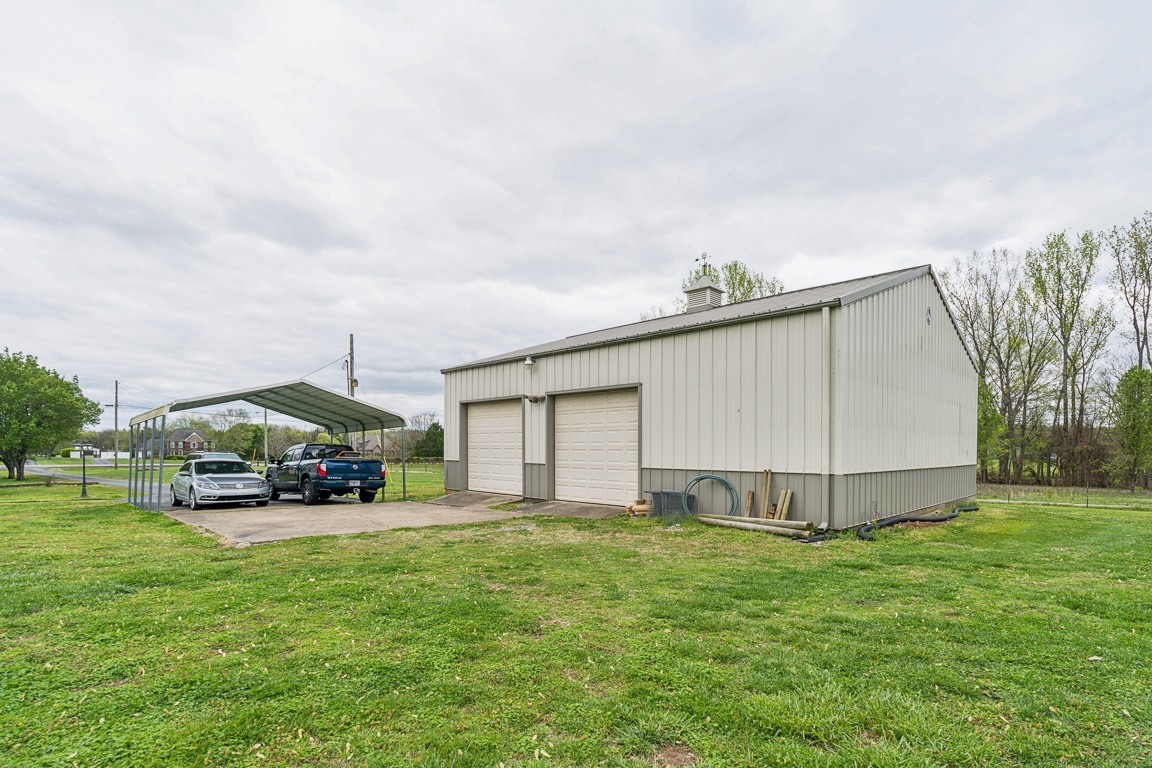 2752 Thompson Road Murfreesboro, TN 37128 - Photo 23 of 32 Car port and additional concrete for project work.