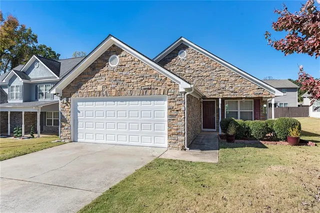 front view of a house with a yard