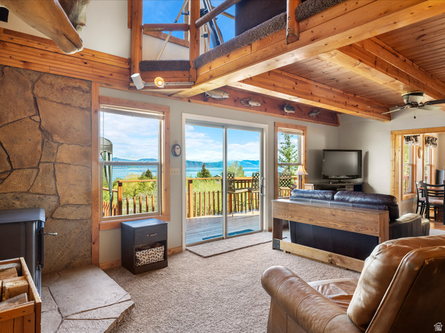 371 Lewis Loop, Unit 29 Fish Haven, ID 83287 - Photo 20 of 40 Living area featuring a stone-clad fireplace and wood-finish ceiling