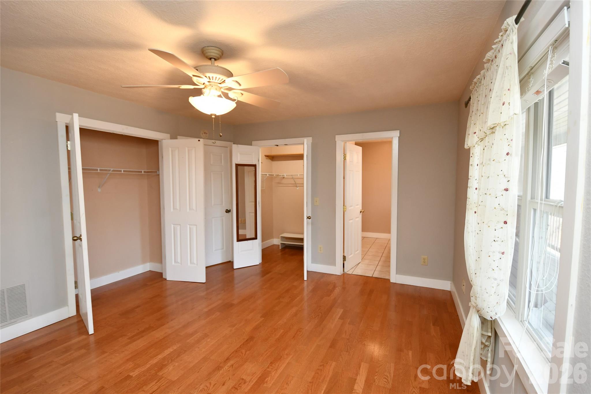 477 West Ridge Drive Burnsville, NC 28714 - Photo 20 of 48 a view of an empty room with wooden floor