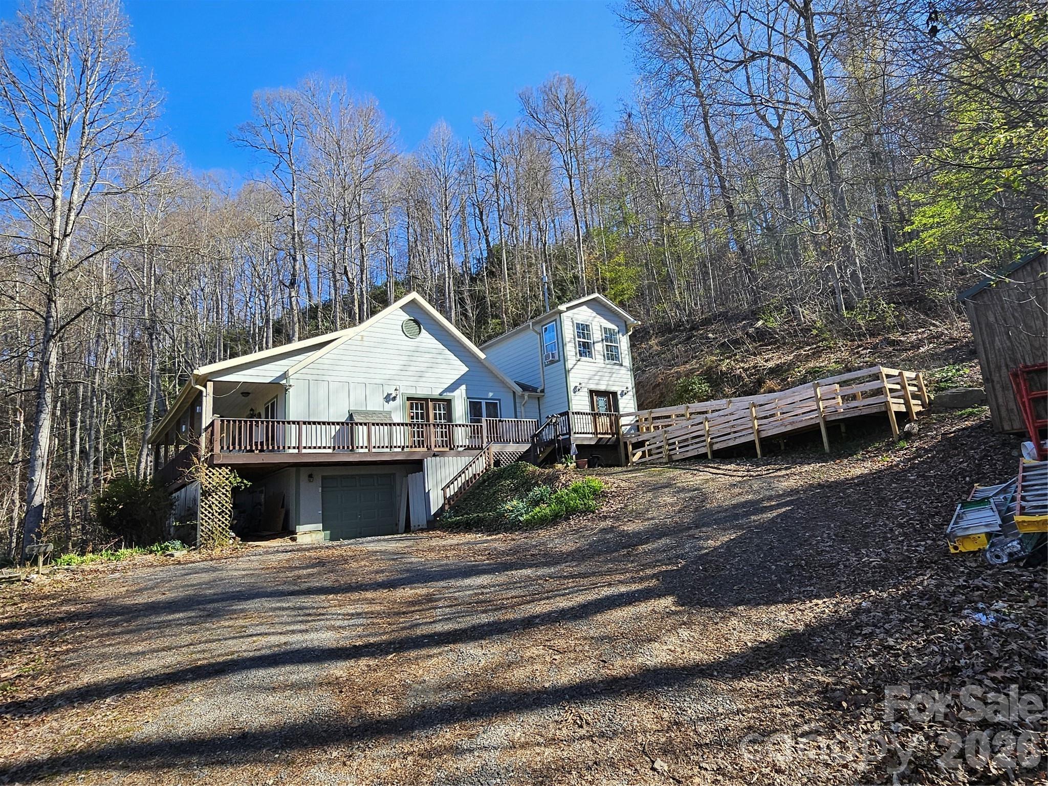477 West Ridge Drive Burnsville, NC 28714 - Photo 2 of 48 a view of a house with a park