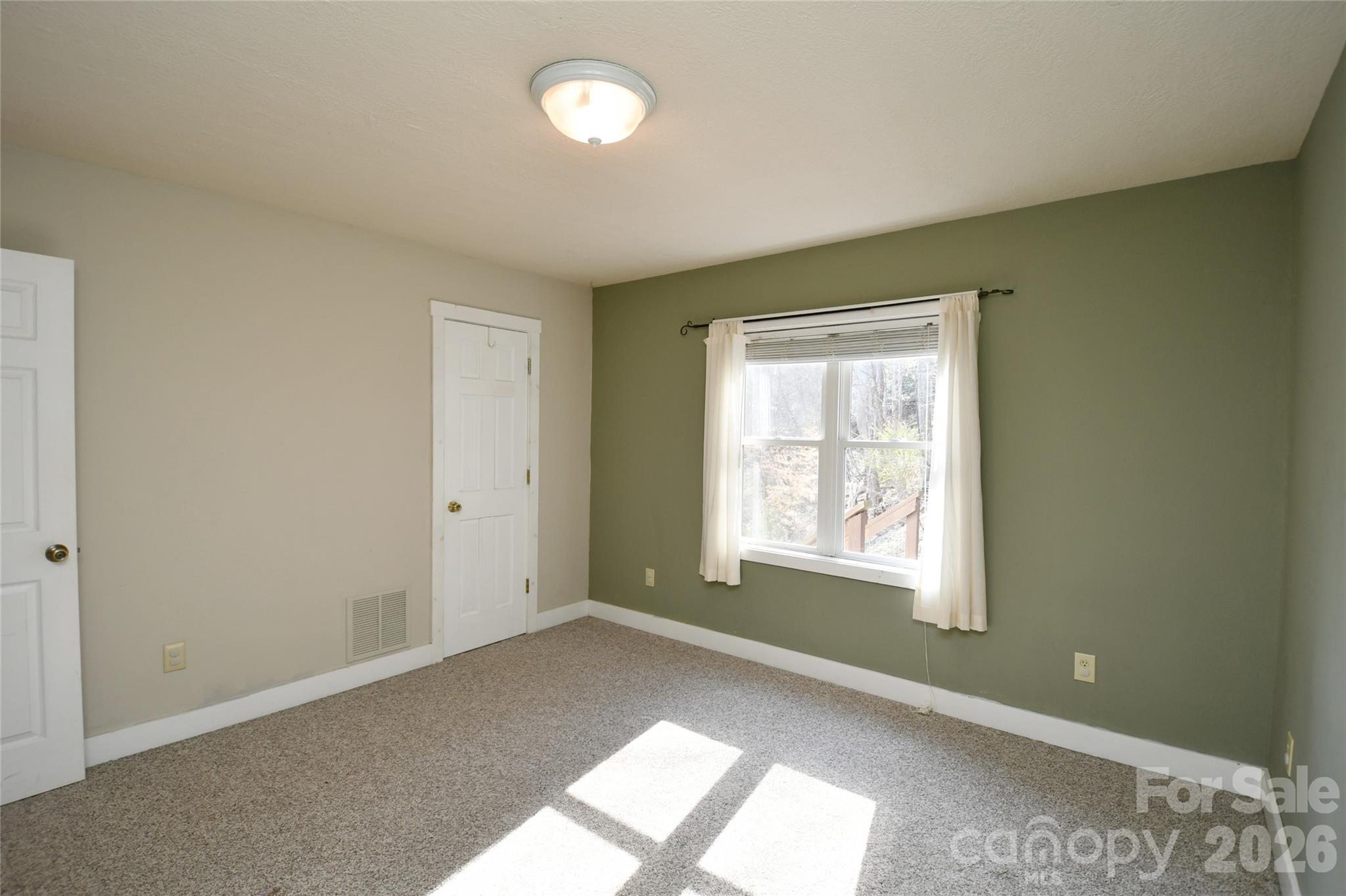 477 West Ridge Drive Burnsville, NC 28714 - Photo 28 of 48 an empty room with windows