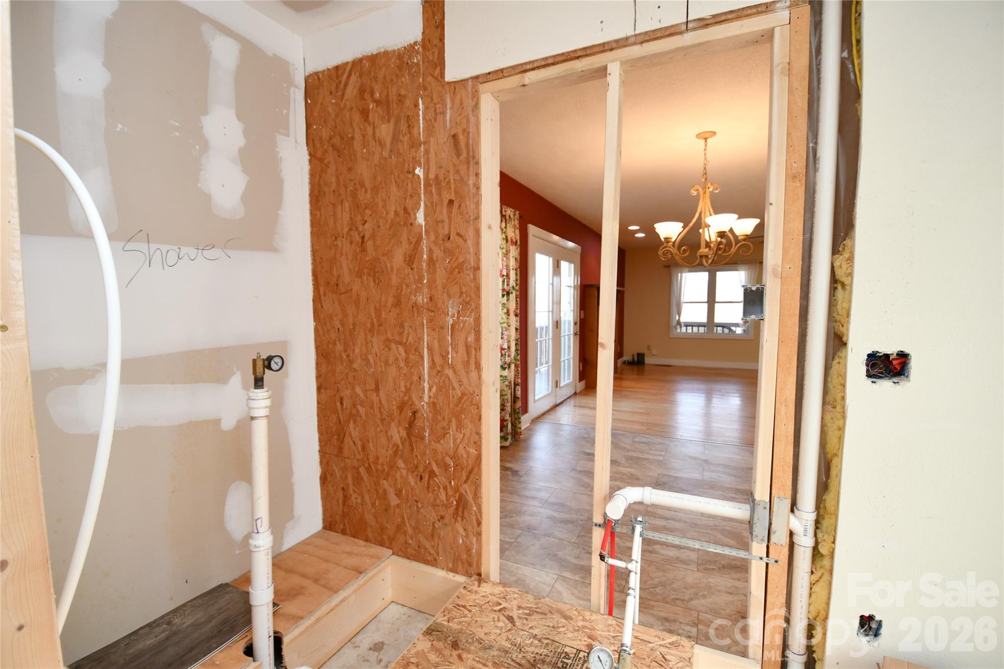 477 West Ridge Drive Burnsville, NC 28714 - Photo 40 of 48 a bathroom with a glass door shower and a mirror
