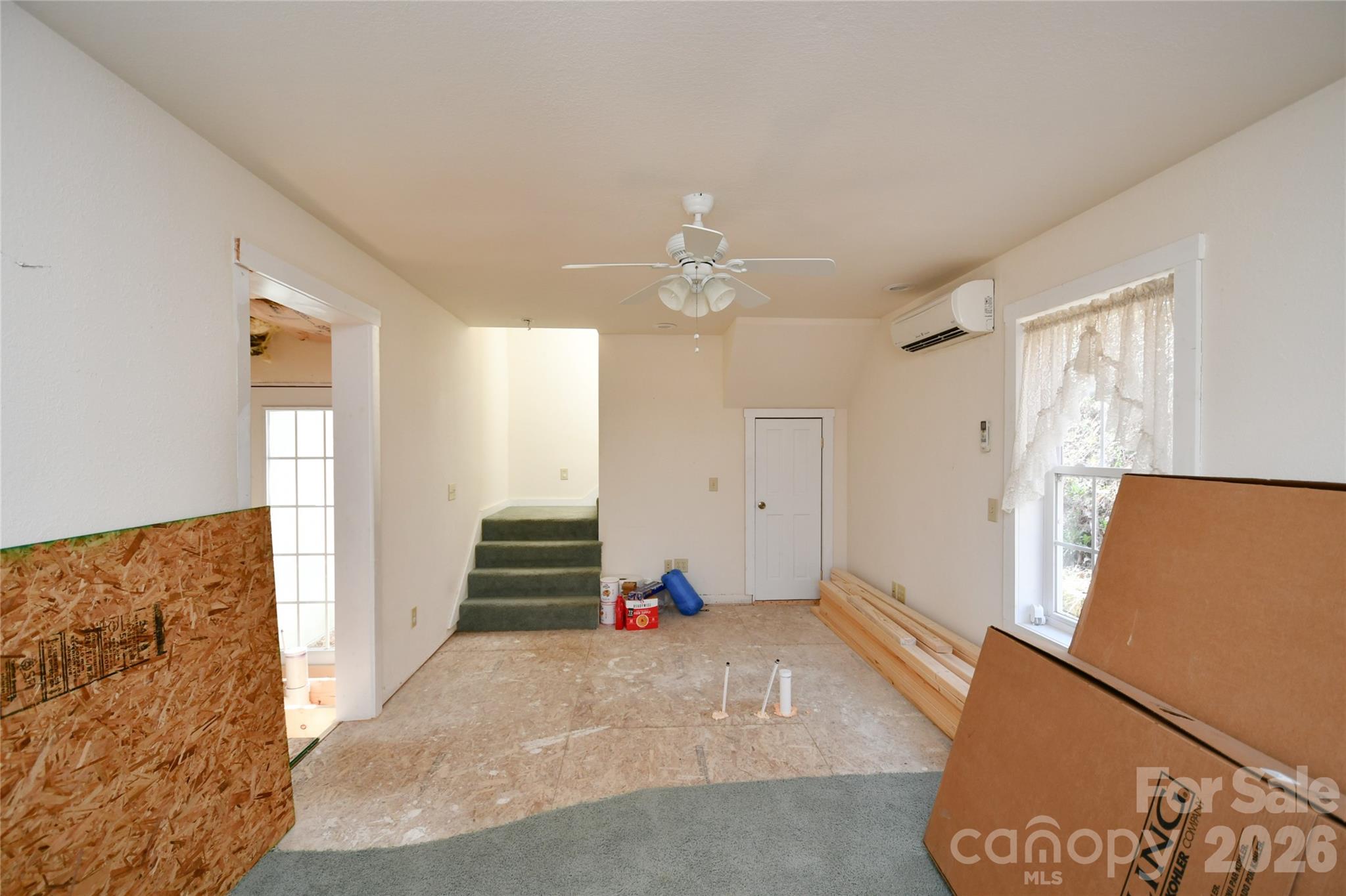 477 West Ridge Drive Burnsville, NC 28714 - Photo 42 of 48 a bedroom with a bed and a couch