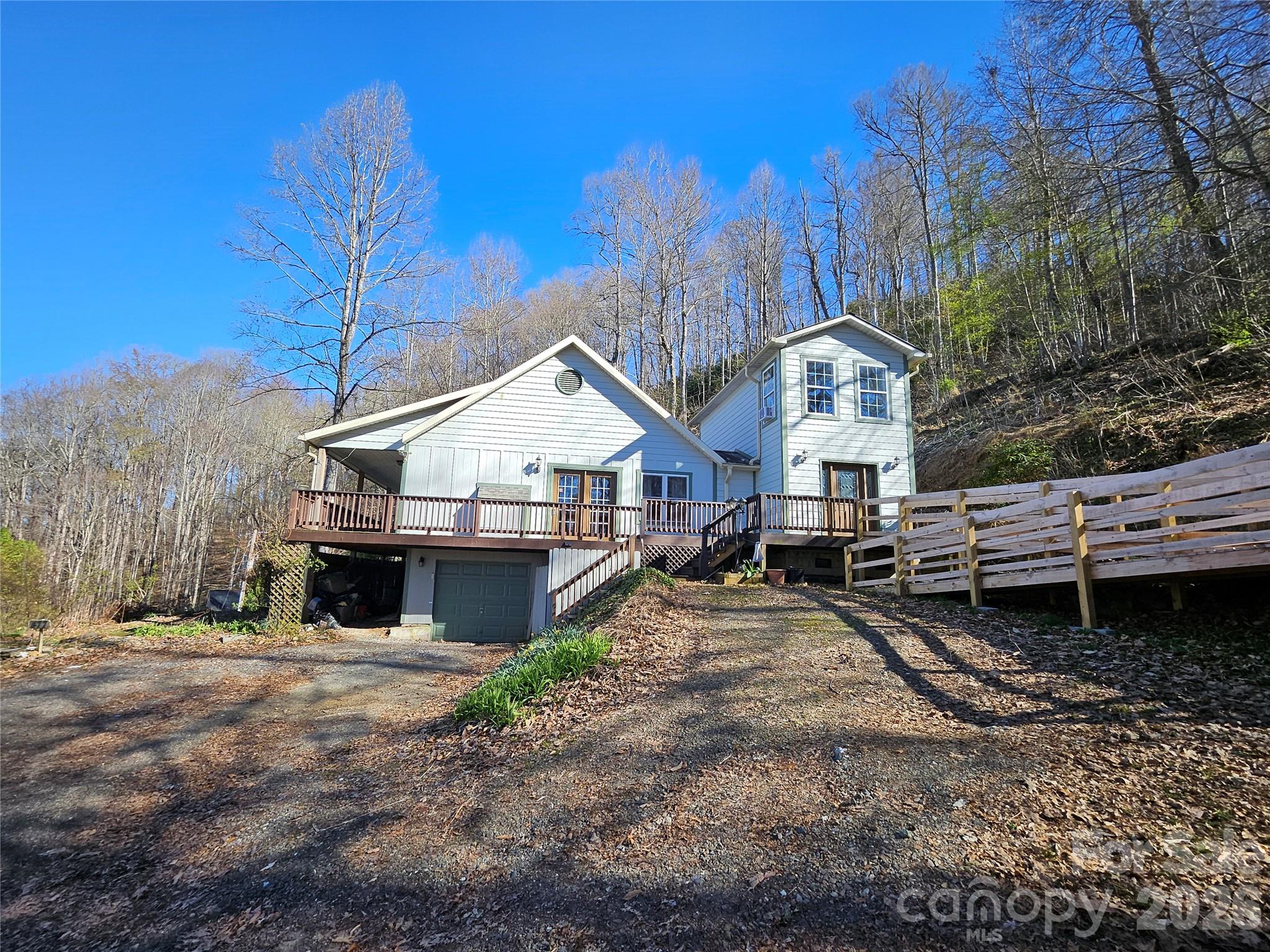 477 West Ridge Drive Burnsville, NC 28714 - Photo 48 of 48 a view of a house with a yard