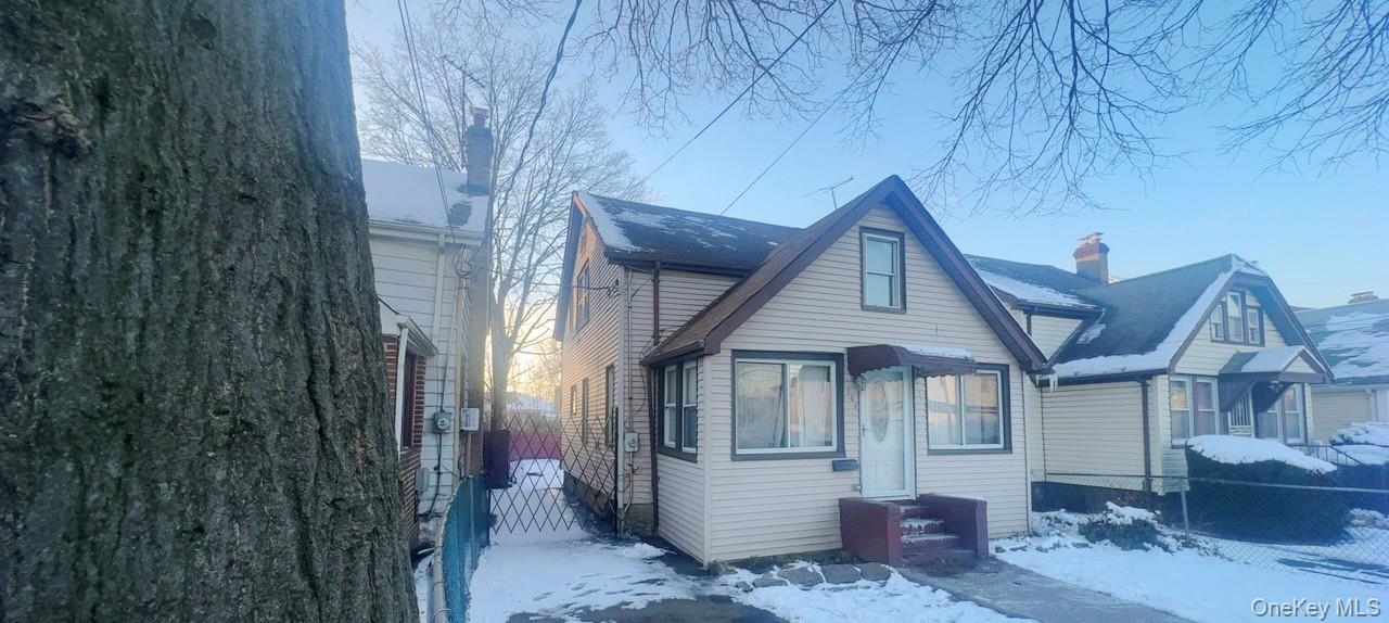 104-14 214th Street Queens, NY 11429 - Photo 3 of 4 a view of a house with a yard
