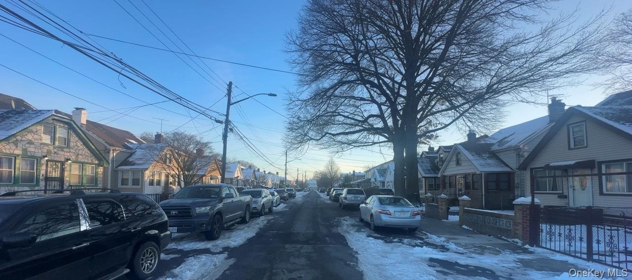 104-14 214th Street Queens, NY 11429 - Photo 4 of 4 View of asphalt road featuring a residential view and street lights