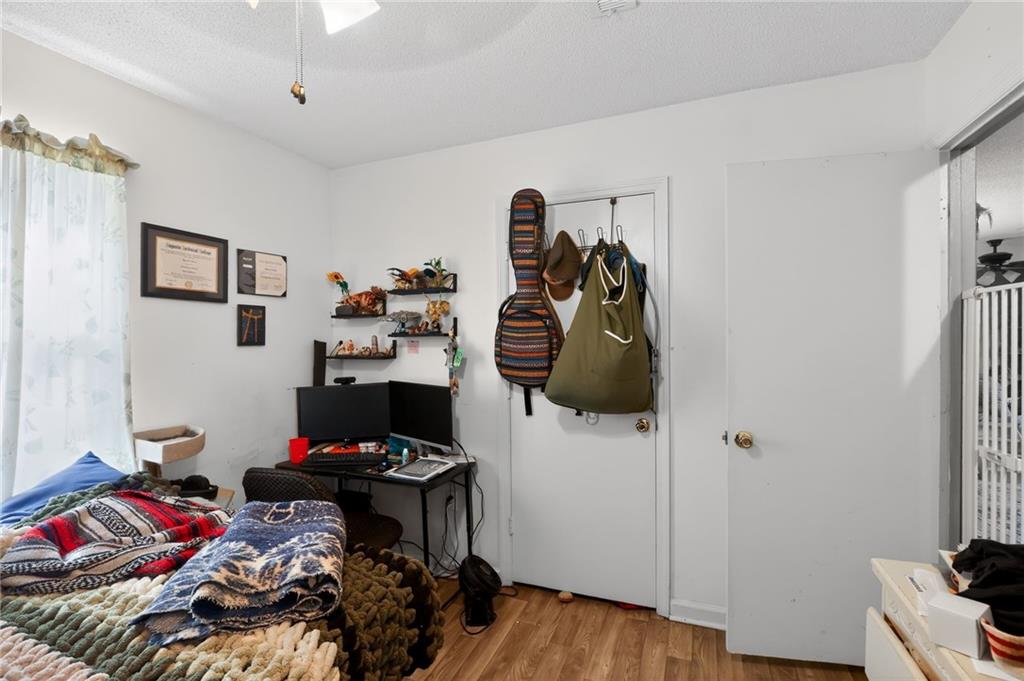 2112 Moncrieff Street Augusta, GA 30906 - Photo 11 of 22 a bedroom with a bed and wooden floor