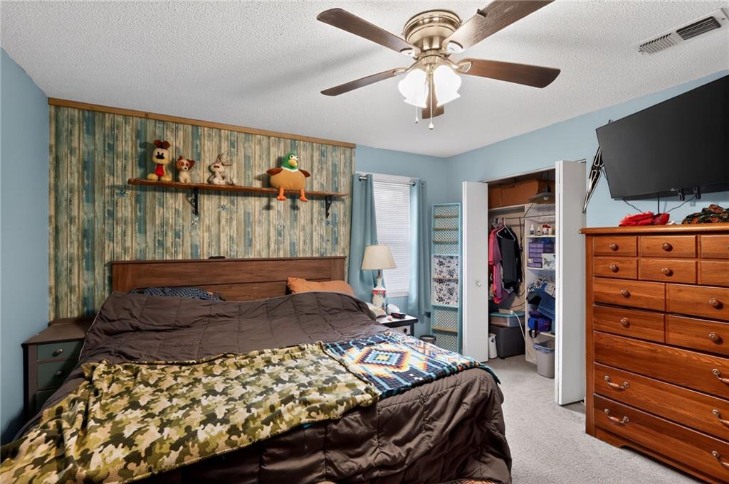 2112 Moncrieff Street Augusta, GA 30906 - Photo 12 of 22 a bedroom with a bed and flat screen tv