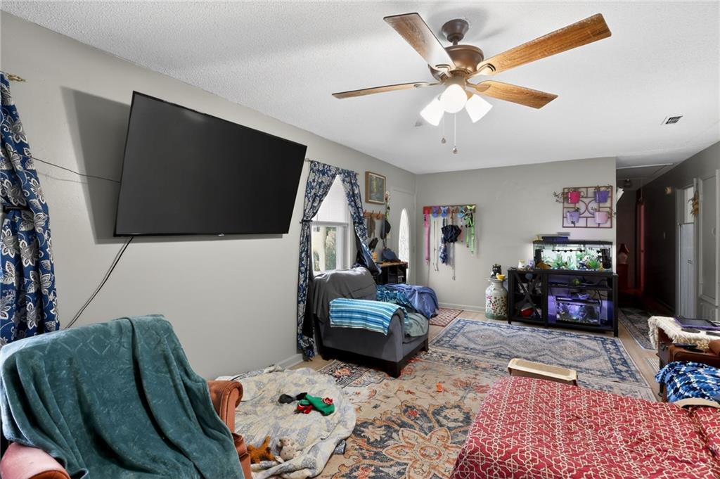 2112 Moncrieff Street Augusta, GA 30906 - Photo 13 of 22 a bedroom with furniture and a flat screen tv