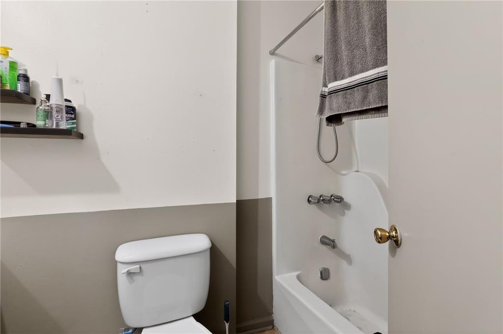 2112 Moncrieff Street Augusta, GA 30906 - Photo 16 of 22 a bathroom with a toilet and a shower