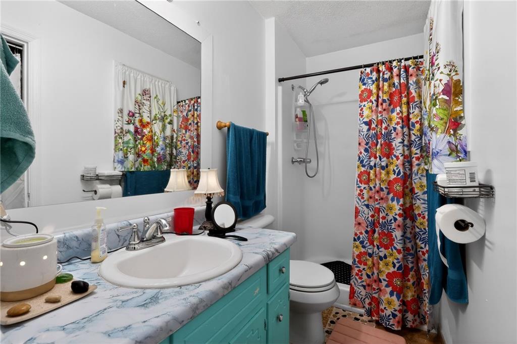 2112 Moncrieff Street Augusta, GA 30906 - Photo 17 of 22 a bathroom with a sink toilet and shower curtain