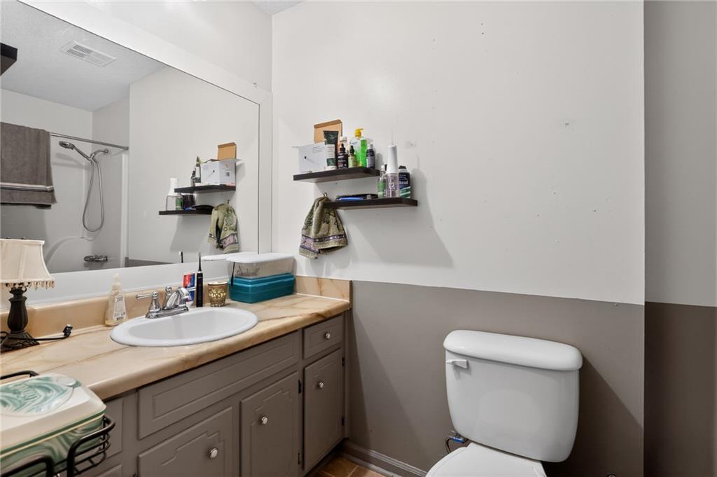 2112 Moncrieff Street Augusta, GA 30906 - Photo 18 of 22 a bathroom with a toilet sink and mirror