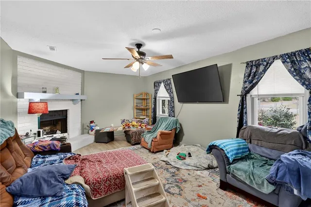 a view of a dining room with furniture and a chandelier