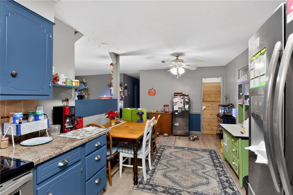 2112 Moncrieff Street Augusta, GA 30906 - Photo 7 of 22 a view of a dining room with furniture and a chandelier