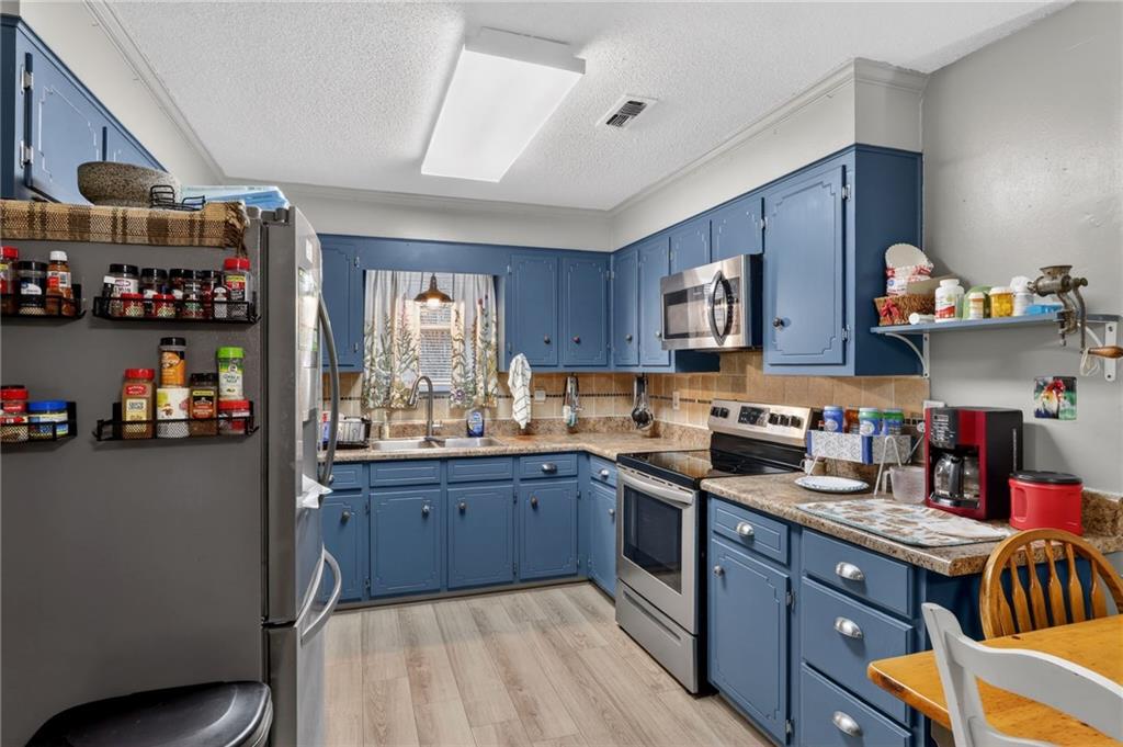 2112 Moncrieff Street Augusta, GA 30906 - Photo 8 of 22 a kitchen with granite countertop lots of counter top space and wooden floor