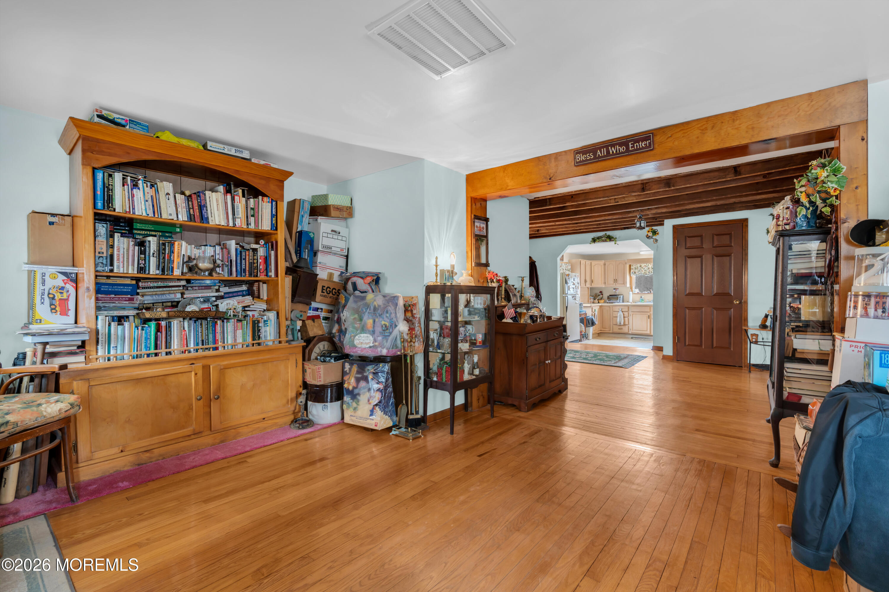 267 Phalanx Road Colts Neck, NJ 07722 - Photo 12 of 36 a living room with furniture and a book shelf
