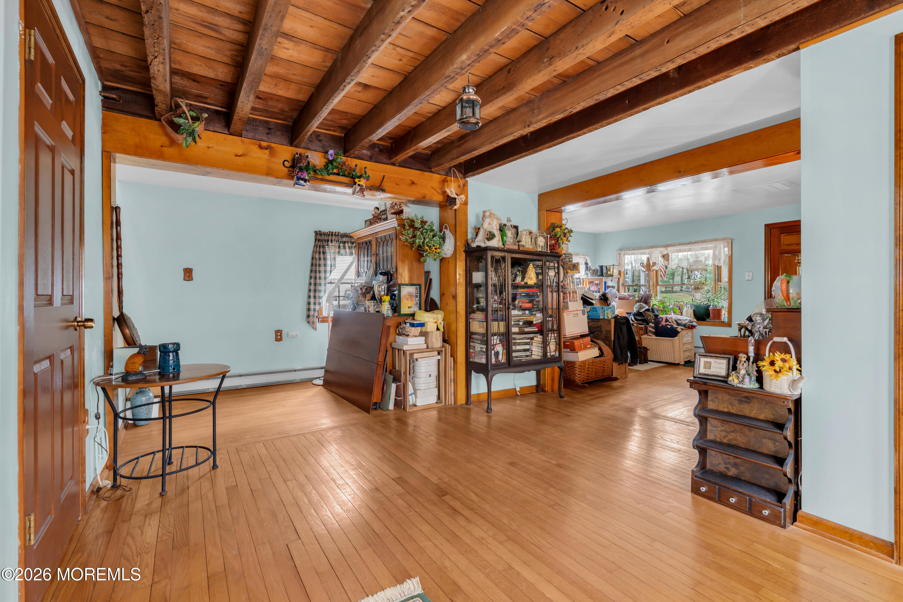 267 Phalanx Road Colts Neck, NJ 07722 - Photo 13 of 36 a view of a livingroom with furniture and a gym equipment