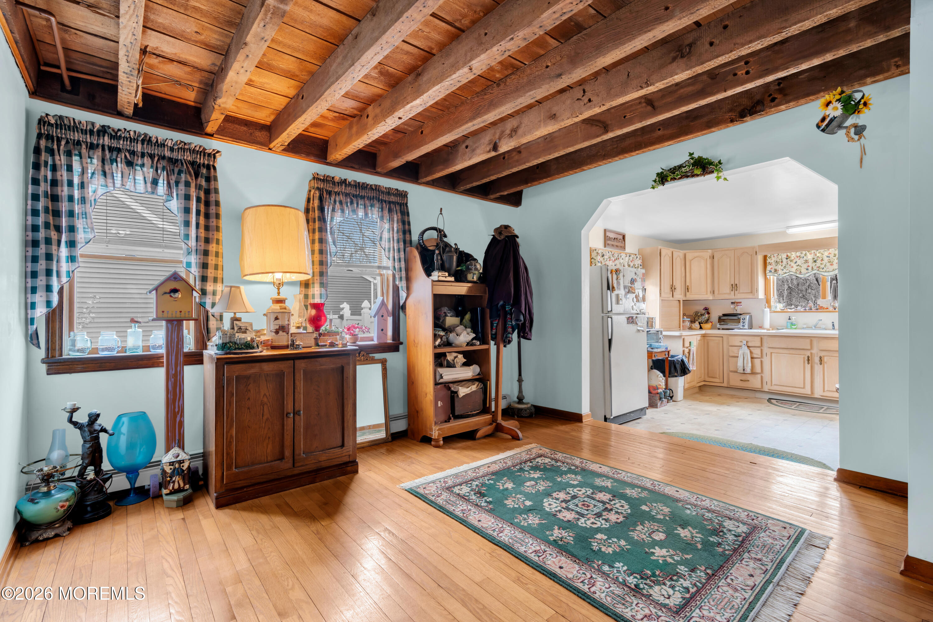 267 Phalanx Road Colts Neck, NJ 07722 - Photo 14 of 36 a room with lots of wooden furniture and a rug