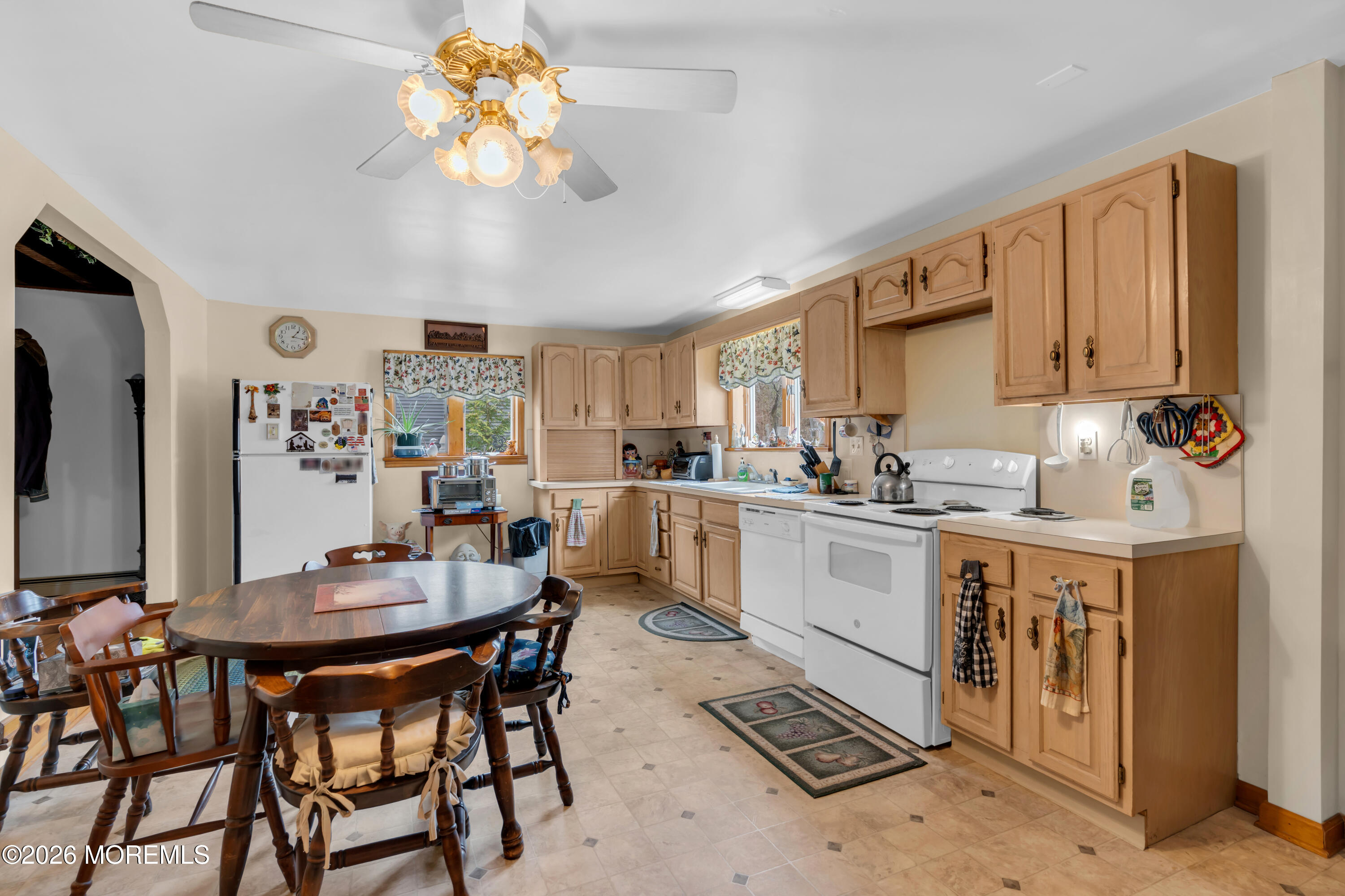 267 Phalanx Road Colts Neck, NJ 07722 - Photo 16 of 36 a kitchen with a dining table cabinets appliances and a window