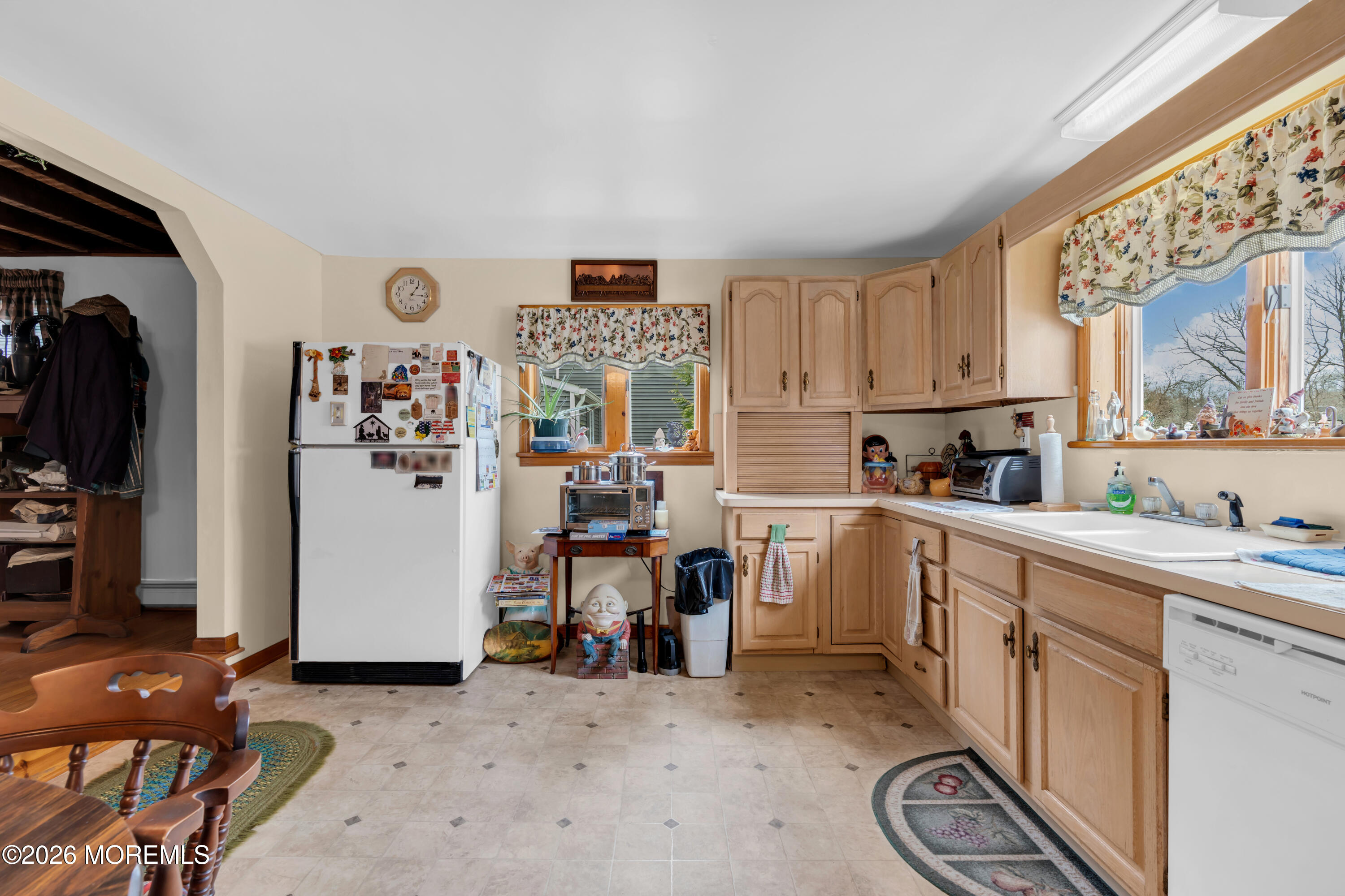 267 Phalanx Road Colts Neck, NJ 07722 - Photo 17 of 36 a view of a kitchen with fridge and workspace
