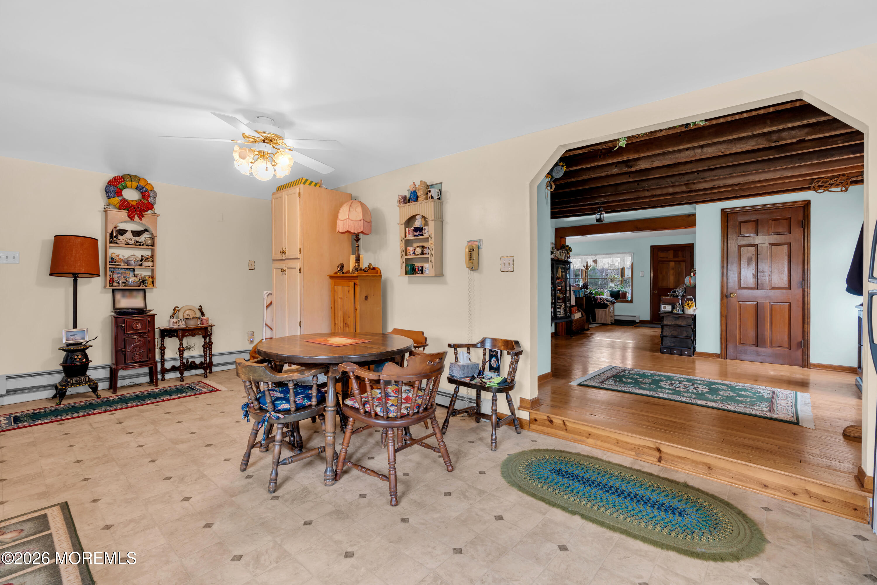 267 Phalanx Road Colts Neck, NJ 07722 - Photo 18 of 36 a living room with furniture a rug and a chandelier
