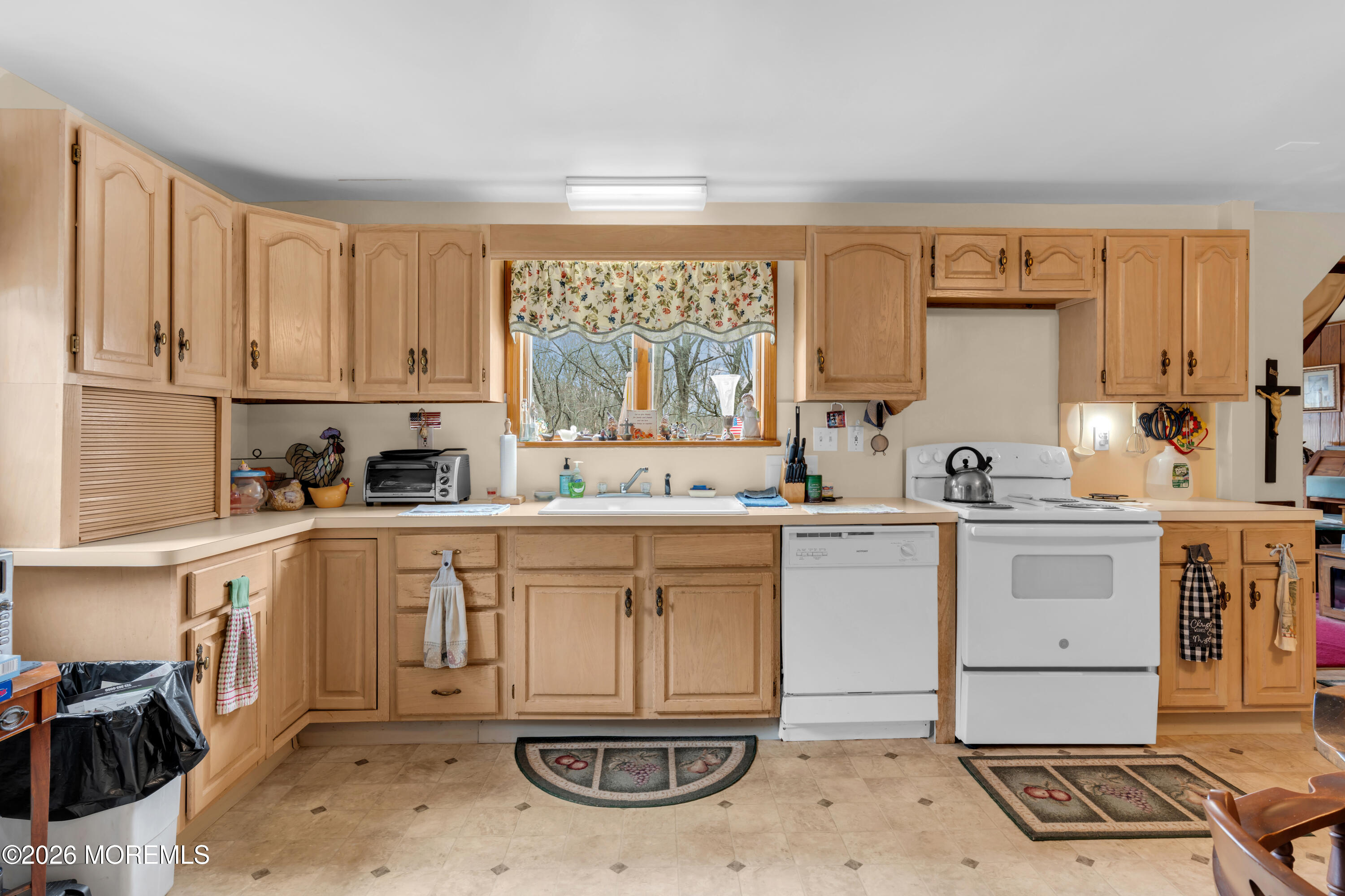 267 Phalanx Road Colts Neck, NJ 07722 - Photo 19 of 36 a kitchen with a sink cabinets and window