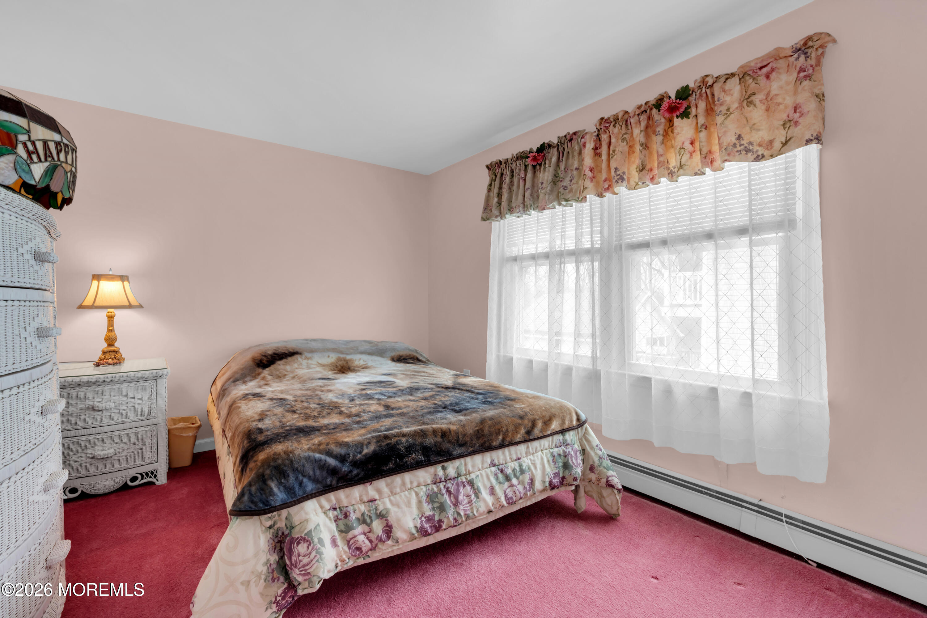 267 Phalanx Road Colts Neck, NJ 07722 - Photo 22 of 36 a bedroom with a bed dresser and a window