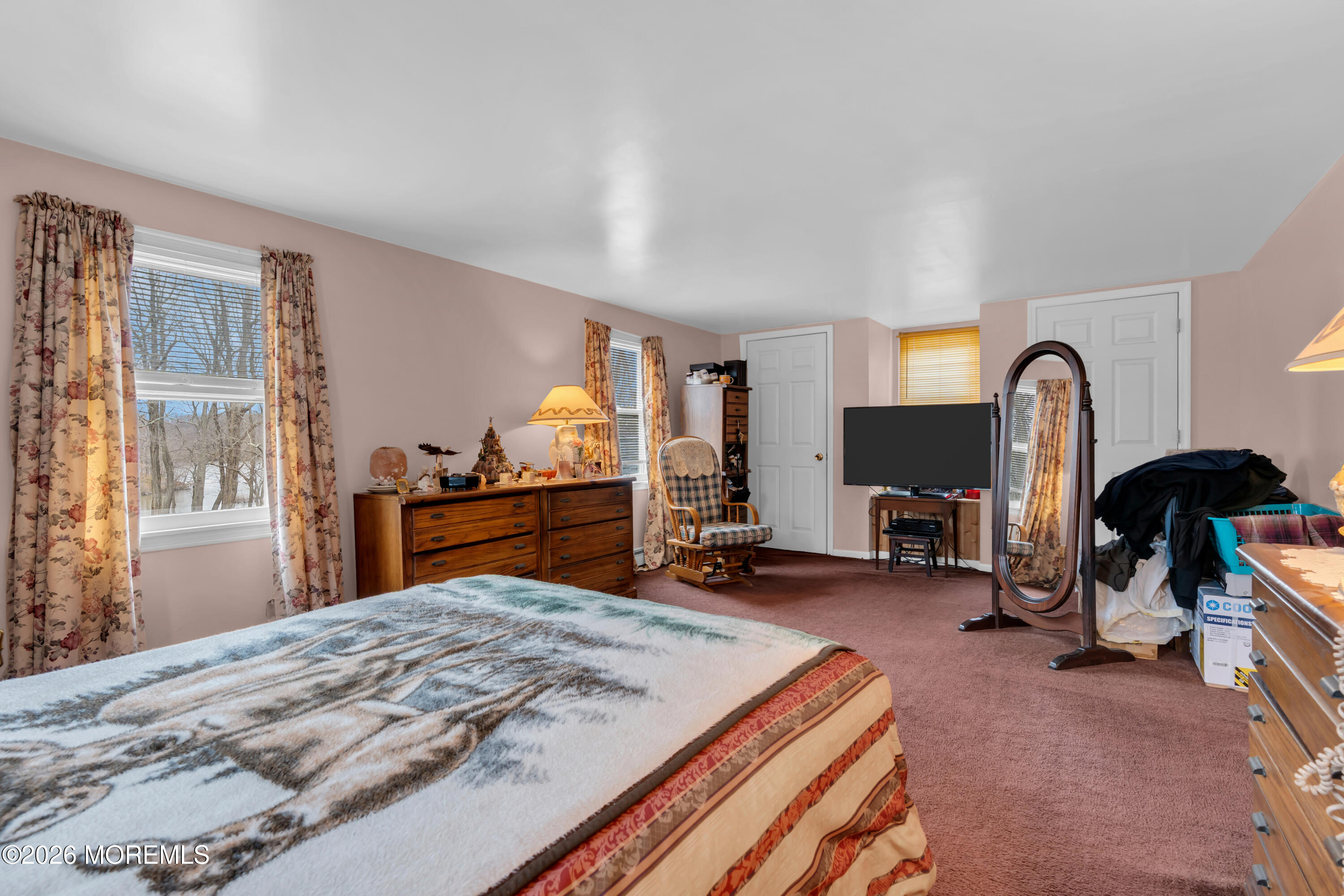 267 Phalanx Road Colts Neck, NJ 07722 - Photo 23 of 36 a bed room with a bed and a television